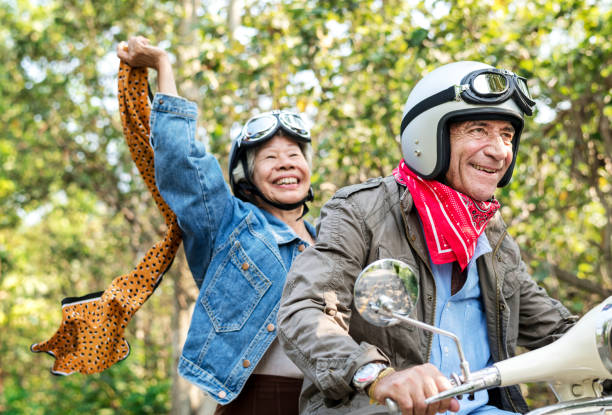 istock Senior couple riding a classic scooter 1022905838
