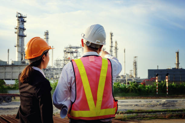 istock The engineers are standing on large industry background. 1022905926