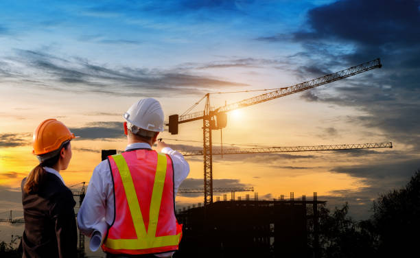 Engineers are standing work on construction. stock photo