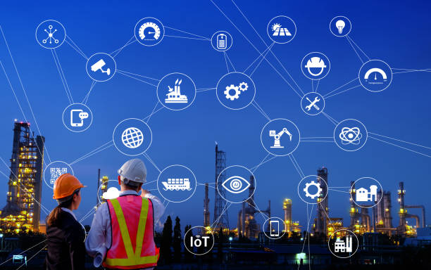 istock The engineers are standing on large industry background. 1022906926