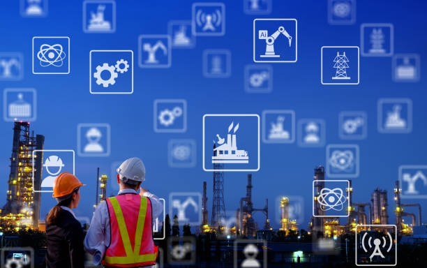 istock The engineers are standing on large industry background. 1022908010