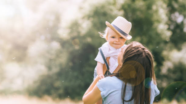istock mother holding adorable little son on hands 1022910736