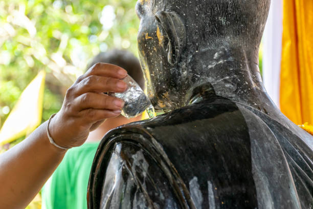 worker was cleaning spirit house., Bangkok, Thailand.