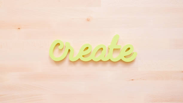 istock Green create sign with paint brushes on the table. 1022917560