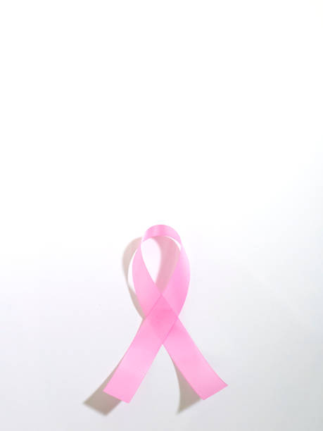 istock Pink breast cancer awareness ribbons on white background 1022920384