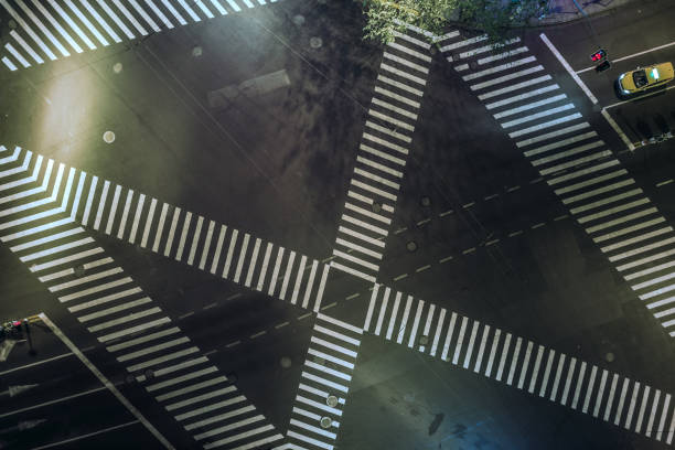 istock Aerial drone view on city intersection during night 1022921600