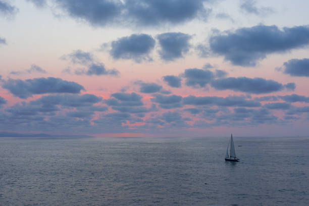 istock Sailing boats with sunset at the sea 1022932764