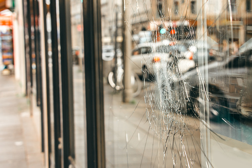 Broken store window in an urban environment