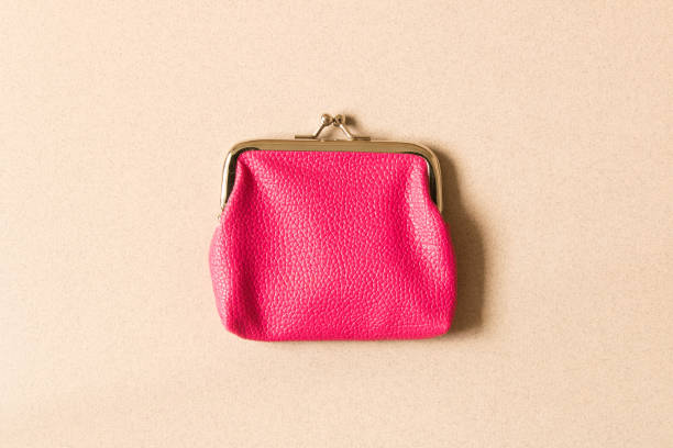istock Pink wallet on light background . Close up. Top view 1022963484
