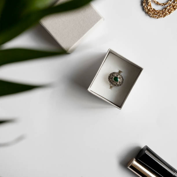 istock Antique ring sparkles in a box with a palm leaf 1022964332