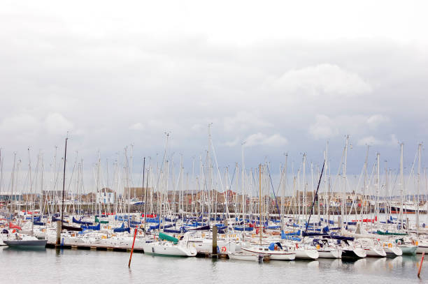 istock sailing ships and yachts anchored in the harbor 1022967680