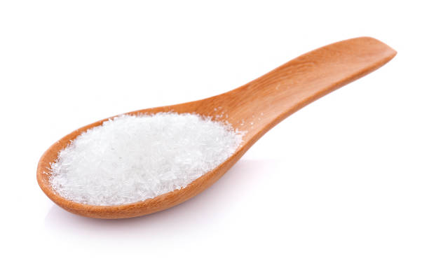 istock MonosodiumGlutamate (MSG or E621) in spoon on white 1022968060