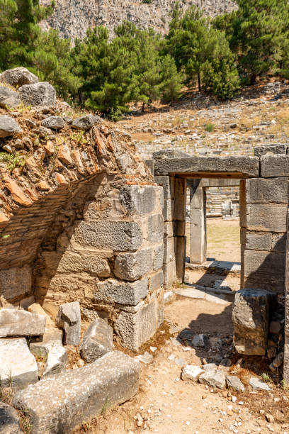riene, ancient city of Ionia about 6 miles (10 km) north of the Menderes (Maeander) River and 10 miles (16 km) inland from the Aegean Sea, in southwestern Turkey. Its well-preserved remains are a major source of information about ancient Greek town planning.
By the 8th century BC Priene was a member of the Ionian League, whose central shrine, the Panionion, lay within the city’s territory. Priene was sacked by Ardys of Lydia in the 7th century BC but regained its prosperity in the 8th. Captured by the generals of the Persian king Cyrus (c. 540), the city took part in several revolts against the Persians (499–494). Priene originally lay along the Maeander River’s mouth, but about 350 BC the citizens built a new city farther inland, on the present site. The new city’s main temple, of Athena Polias, was dedicated by Alexander the Great in 334. The little city grew slowly over the next two centuries and led a quiet existence; it prospered under the Romans and Byzantines but gradually declined, and after passing into Turkish hands in the 13th century AD, it was abandoned. Excavations of the site, which is occupied by the modern town of Samsun Kale, began in the 19th century.
Modern excavations have revealed one of the most beautiful examples of Greek town planning. The city’s remains lie on successive terraces that rise from a plain to a steep hill upon which stands the Temple of Athena Polias. Built by Pythius, probable architect of the Mausoleum of Halicarnassus, the temple was recognized in ancient times as the classic example of the pure Ionic style. Priene is laid out on a grid plan, with 6 main streets running east-west and 15 streets crossing at right angles, all being evenly spaced. The town was thereby divided into about 80 blocks, or insulae, each averaging 150 by 110 feet (46 by 34 m). About 50 insulae are devoted to private houses; the better-class insulae had four houses apiece, but most were far more subdivided. aydin - turquía. 03 de junio, ruinas de la antigua ciudad de priene. soke, aydin - turkey.priene es una antigua ciudad helenística situada justo al norte de mileto en turquía occidental. fue una antigua ciudad griega de santo y el inicio de un importan