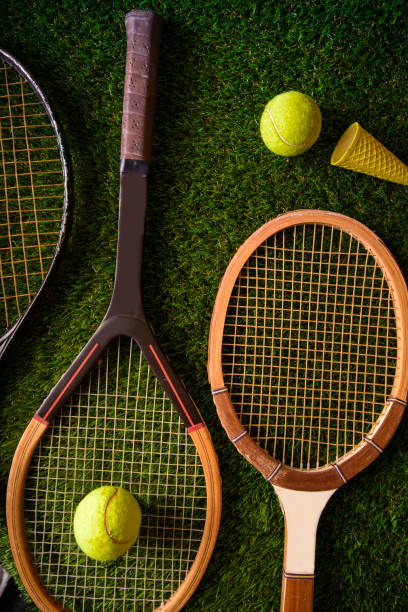 istock Tennis rackets on green grass 1022982468