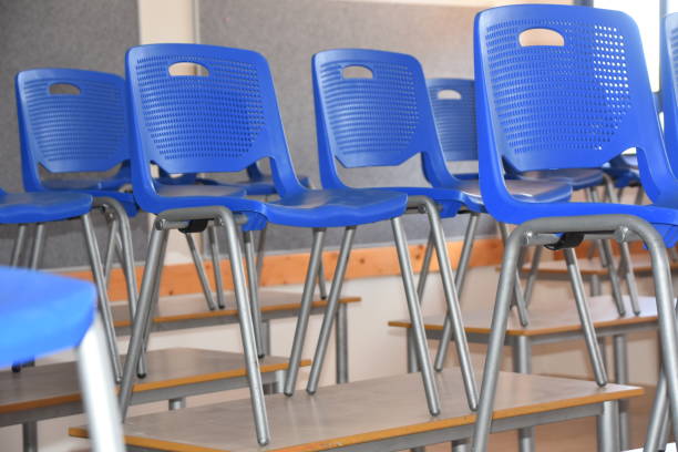 istock Chairs are arranged on the table in class 1022982658