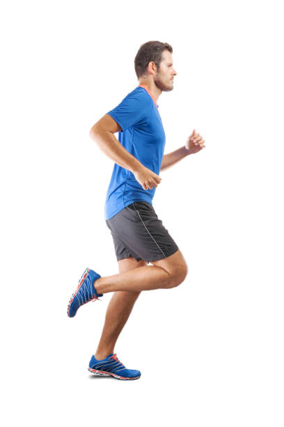 Young attractive athlete running and showing perfect running technique Young attractive athlete running and showing perfect running technique. View from the profile side. Isolated cut out on white background. full body isolated stock pictures, royalty-free photos & images