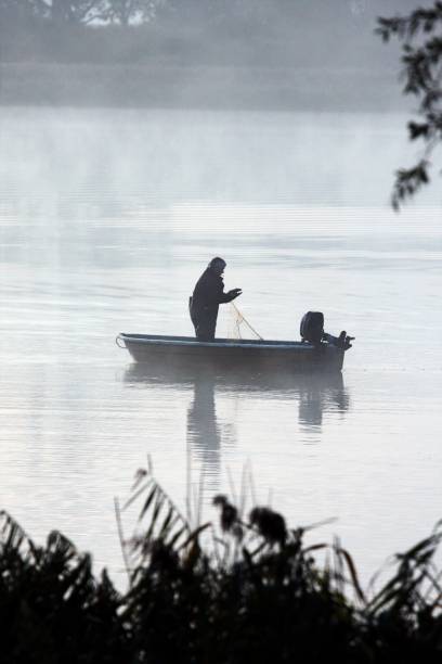 istock Man In Boat On Lake 1022995048