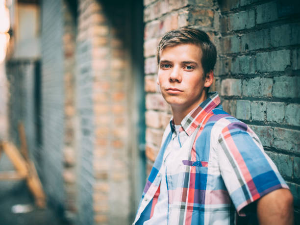 A young man in a downtown city urban environment.