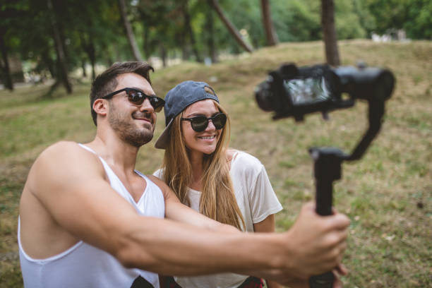 istock Lovely couple vlogging in forest 1023006572