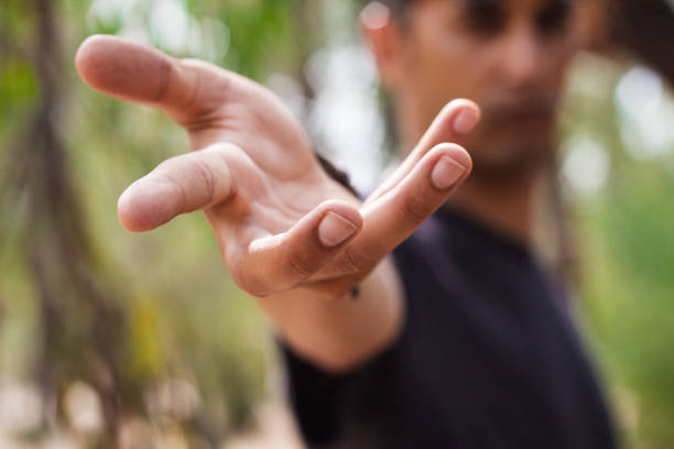 istock young man hand pointing to camera - provides hand - offering his support to you 1023006782