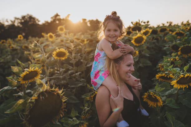 istock Serene family in a sunflower field 1023016800