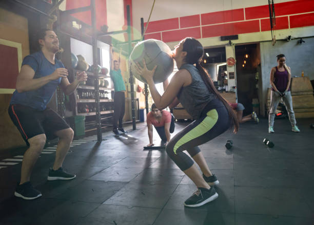istock Happy coach working out with female customer at the gym 1023023122