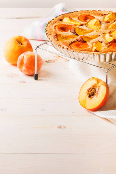 istock Peach pie in almond cream 1023026496