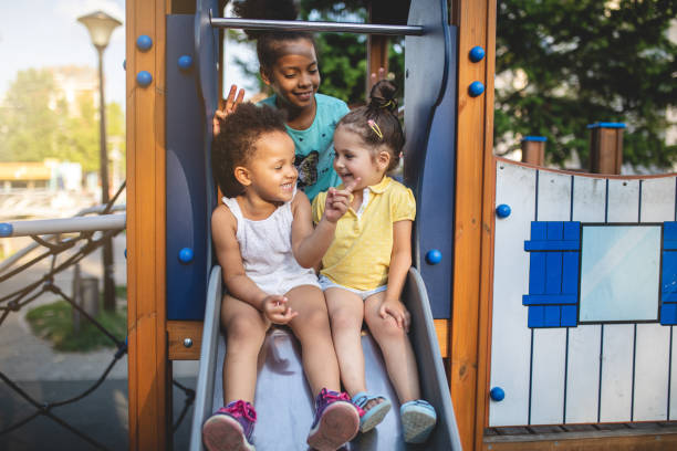 istock Mixed race siblings having fun on a playground together 1023039328