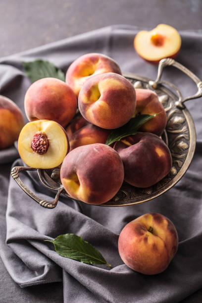 istock A group a ripe peaches in rustic bowl. 1023042442