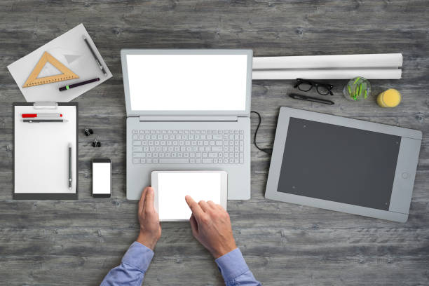 istock Architect holding tablet knolling overhead view business template 1023042454
