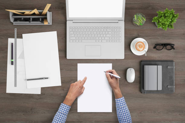 istock Architect designer writing on a blank piece of paper, copy space template - top view 1023042512