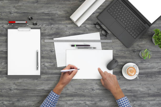 istock Architect designer writing on a blank piece of paper, copy space template - top view 1023042568