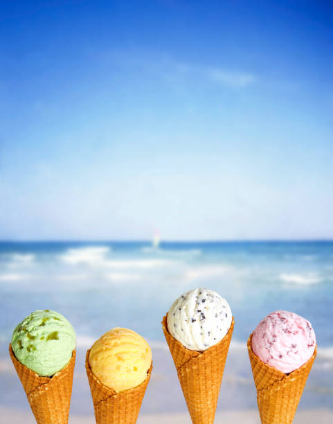 istock Ice cream cones on blue beach background 1023047578