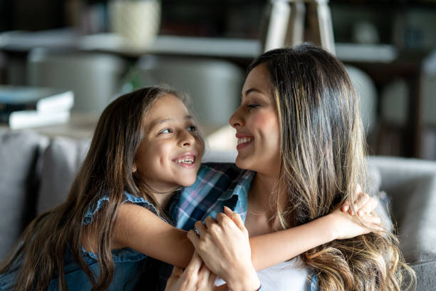 istock Mom and daughter looking at each other smiling and hugging 1023053134