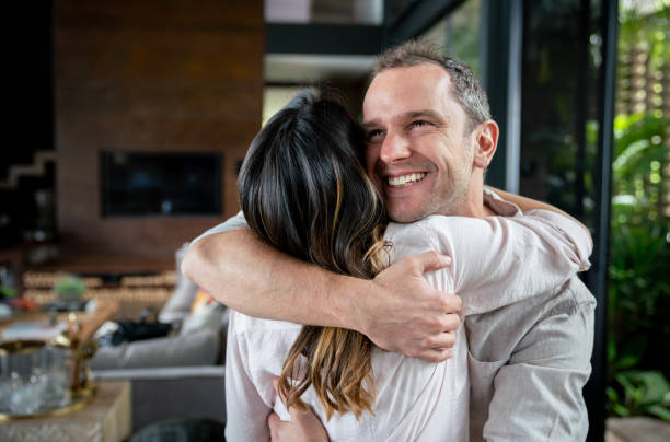 istock Sweet man hugging his partner looking excited 1023053274