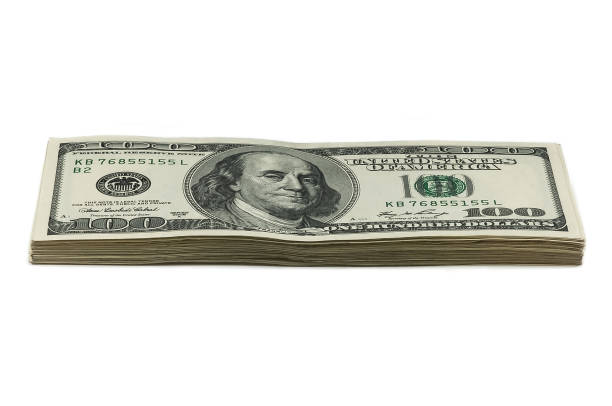 istock A small stack of one hundred dollar bills on a white background. View at an angle. 1023053510