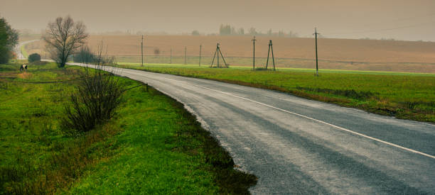 landscape with an asphalt road in the countryside.