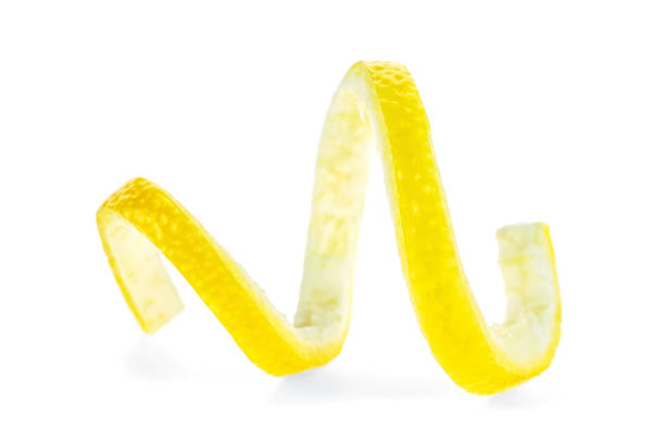 lemon twist on white background - torcido imagens e fotografias de stock