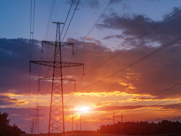 istock high-voltage power lines at sunset. electricity distribution station . 1023078414
