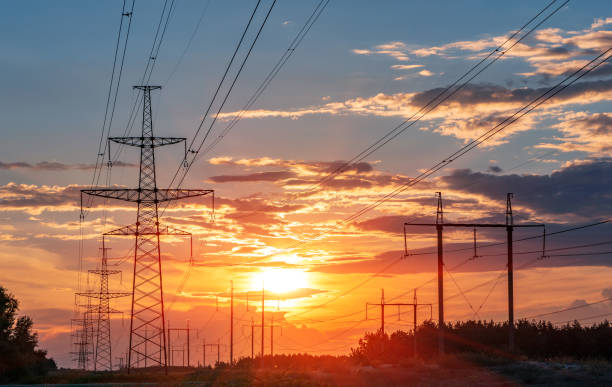 istock high-voltage power lines at sunset. electricity distribution station . 1023078766