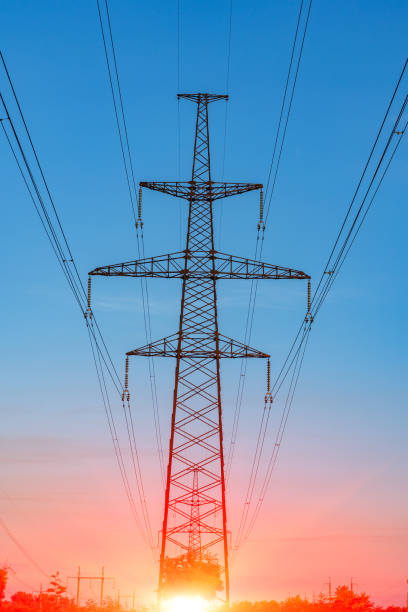 istock high-voltage power lines at sunset. electricity distribution station . 1023078772