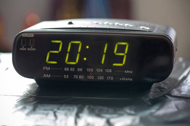 istock Alarm clock is showing midnight. It is twenty nineteen , christmas and bokeh, 1023081650