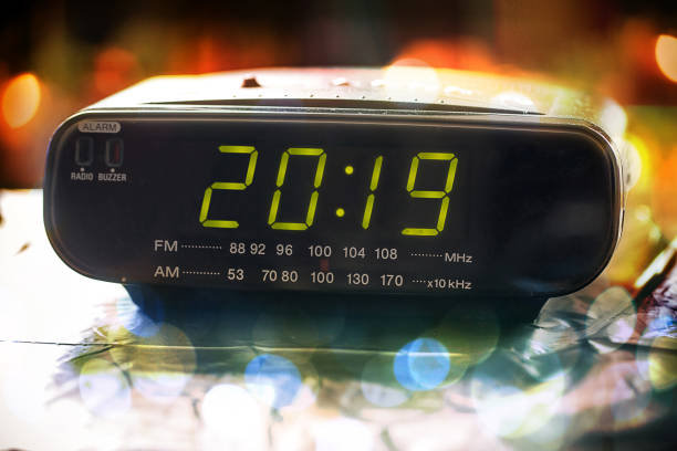 istock Alarm clock is showing midnight. It is twenty nineteen , christmas and bokeh, 1023082080