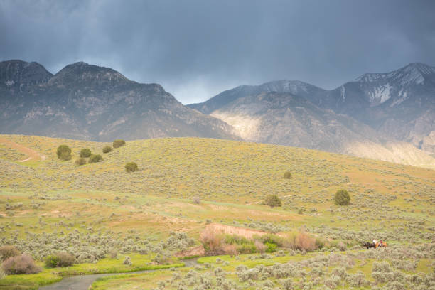 istock Horse wagon in Utah mountains, dramatic sky 1023090672