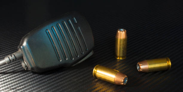 istock Police microphone and handgun ammo 1023093520