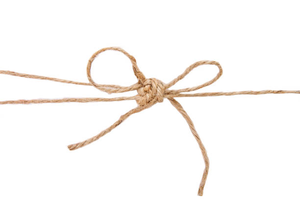 istock Beige rope from burlap isolated on white background 1023093592