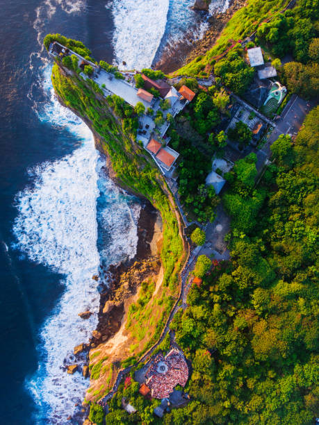 istock Uluwatu Temple aerial view at sunset 1023100592