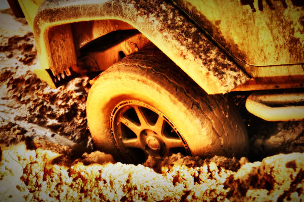 HD Background Image 4x4 Off-Road Wheels Stuck in Mud