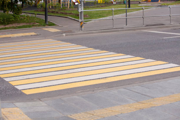 istock Zebra traffic walk way pedestrian crossing on road 1023112538