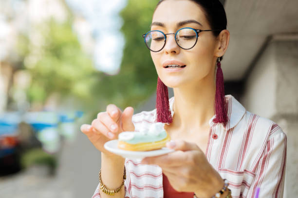 istock Curious woman looking at the dessert before eating it 1023115204